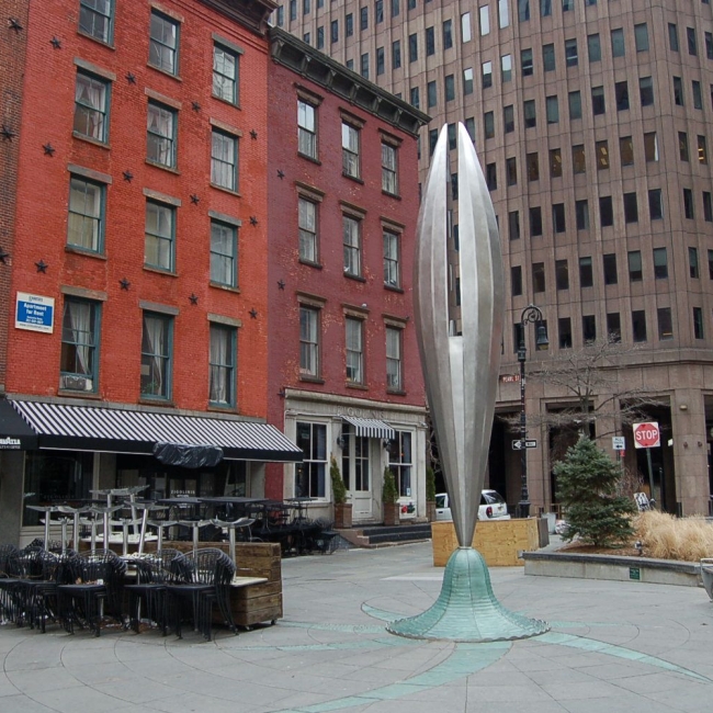 brack facade buildings with a statue in the middle