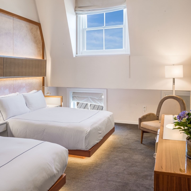 bedroom with two queen beds and large vaulted ceilings