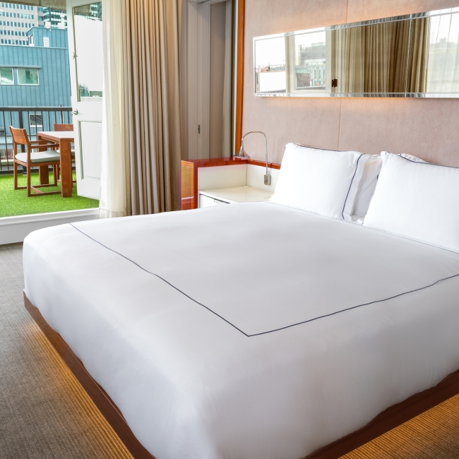 large king bed with white linen