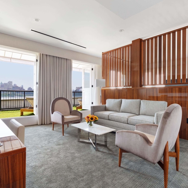 large room with indoor seating and large terrace